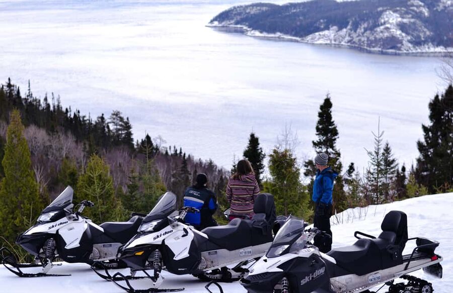 15 min. Tadoussac: Snowmobile Expedition in Saguenay Fjord - Riding from Sacré-Coeur toward the fjord