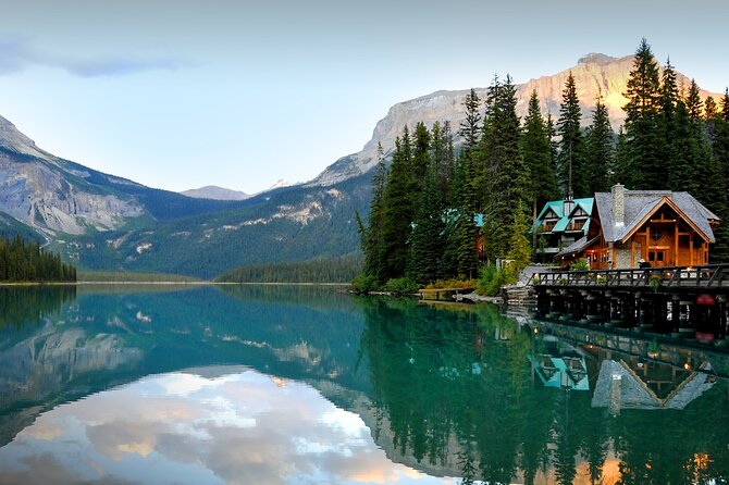 8 Iconic Stops. 12 Comfy Seats. See Banff's Best in First Class. - Lake Louise begins the day with a classic view