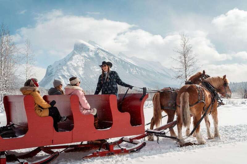Banff: Family Friendly Horse-Drawn Sleigh Ride - Arriving at the red stables on Sundance Road
