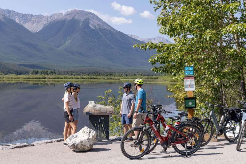 Banff: Mountain Lakeside Guided E-Bike Tour - Lake Minnewanka and the town beneath the water