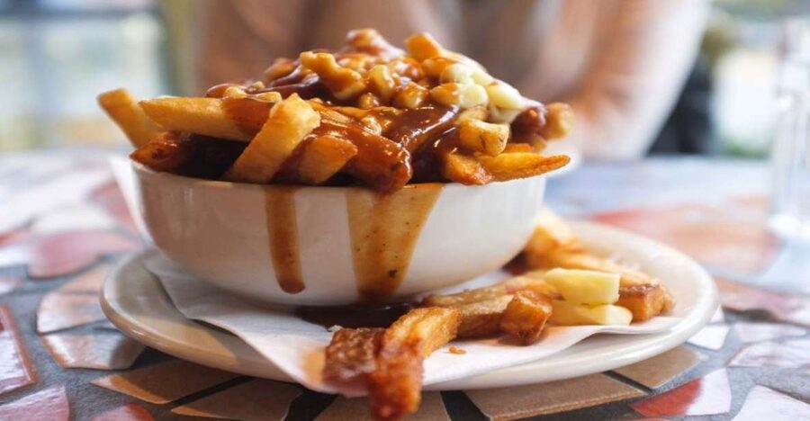 Montreal: Best of Montreal Food Walking Tour with Tastings - Poutine brings the heavy course early