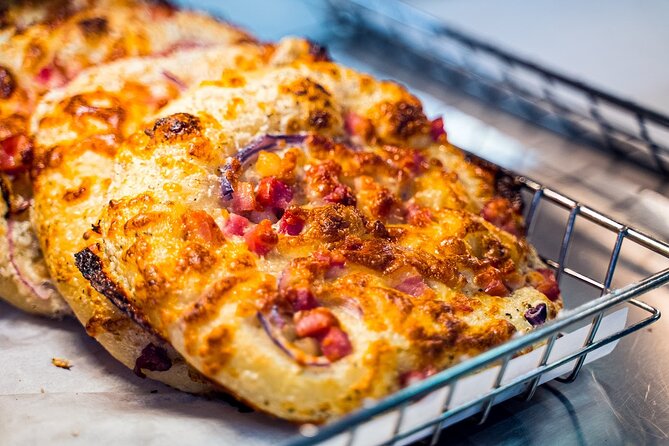 Montreal Mile End Authentic Food Tour with 7 Delicacies Tastings - Montreal smoked meat, bagels, and poutine
