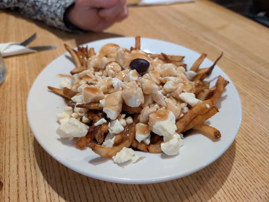 Montreal: Mile End District Food Tour with 8+ Tastings - The salami and cheese sandwich keeps the meal moving