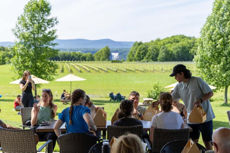 Quebec City: Ile d'Orléans Guided E-Bike Tour with Tastings - Chocolate and river views in St. Petronille