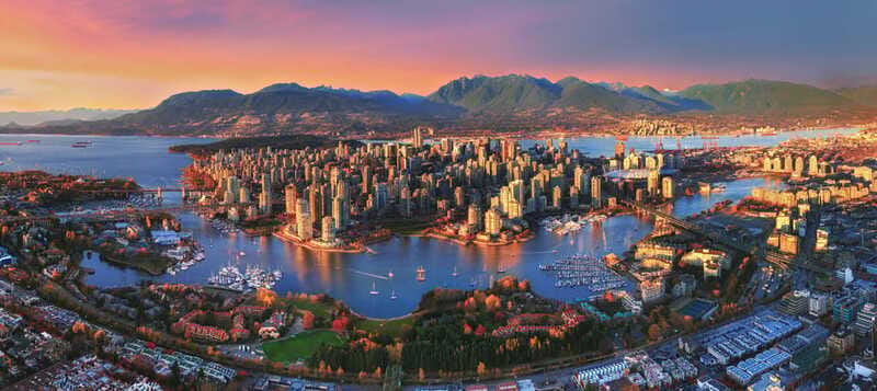 Sunset Bus Tour: Stanley Park & English Bay Photostops - Through downtown toward the bridges