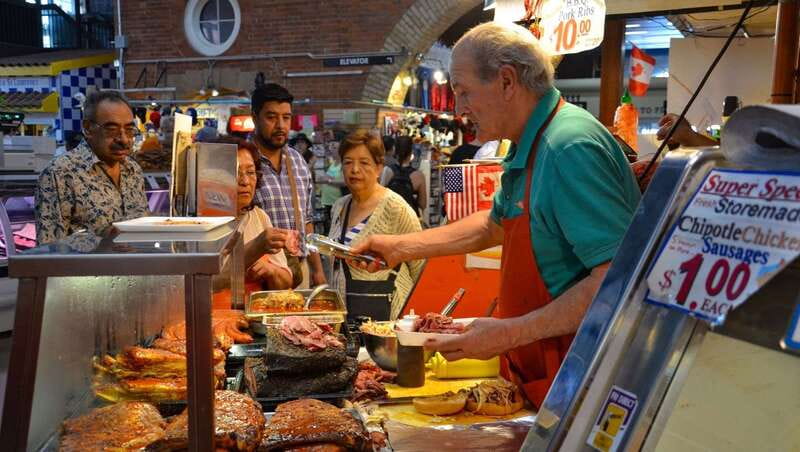 Toronto Food Tour with Local Foodie, Personalized & Private - The Distillery District: cobblestones, old buildings, and a shared drink