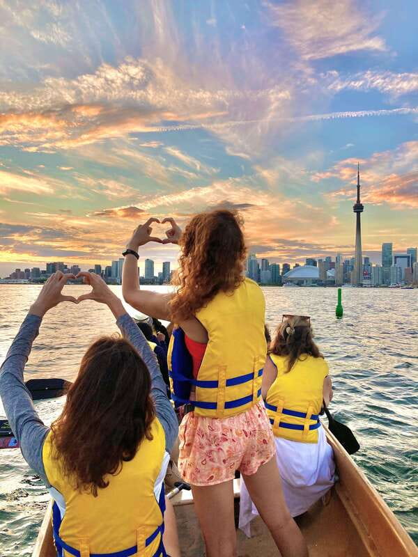 Toronto Islands: Sunset Canoe Tour - Getting comfortable in the Voyageur-style canoe