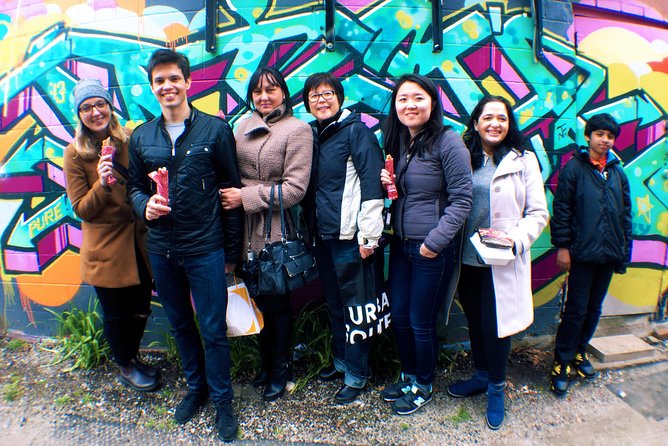 Toronto's First Food Tour: Taste the World in Kensington Market - Walking through independent shops and street art